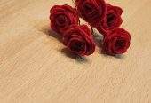 Red rose hair pins by Zarwish Javid