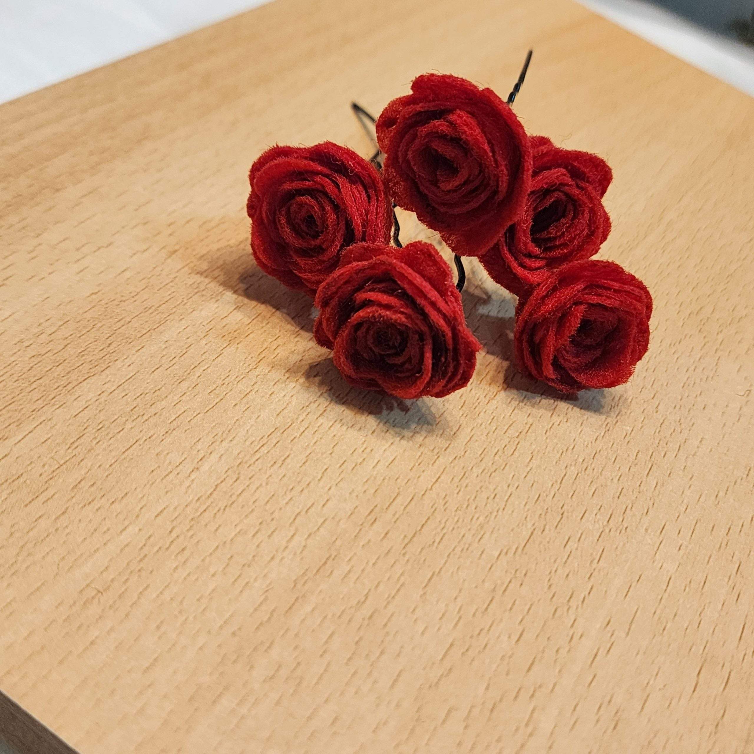Red rose hair pins by Zarwish Javid