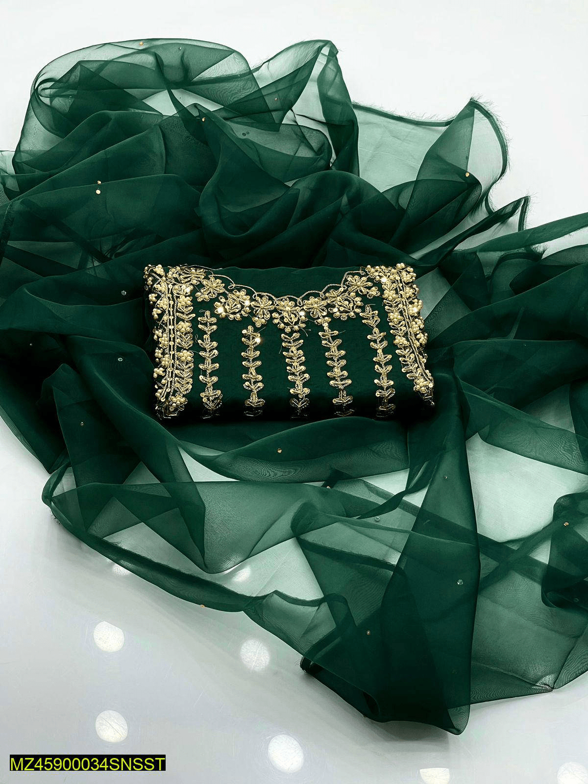 Woman’s unstiched clothes by Muhammad Naveed