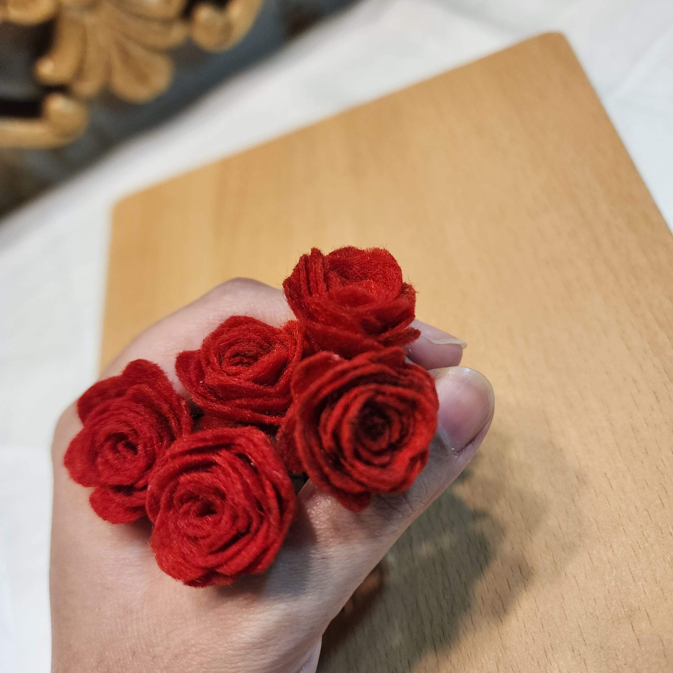Red rose hair pins by Zarwish Javid