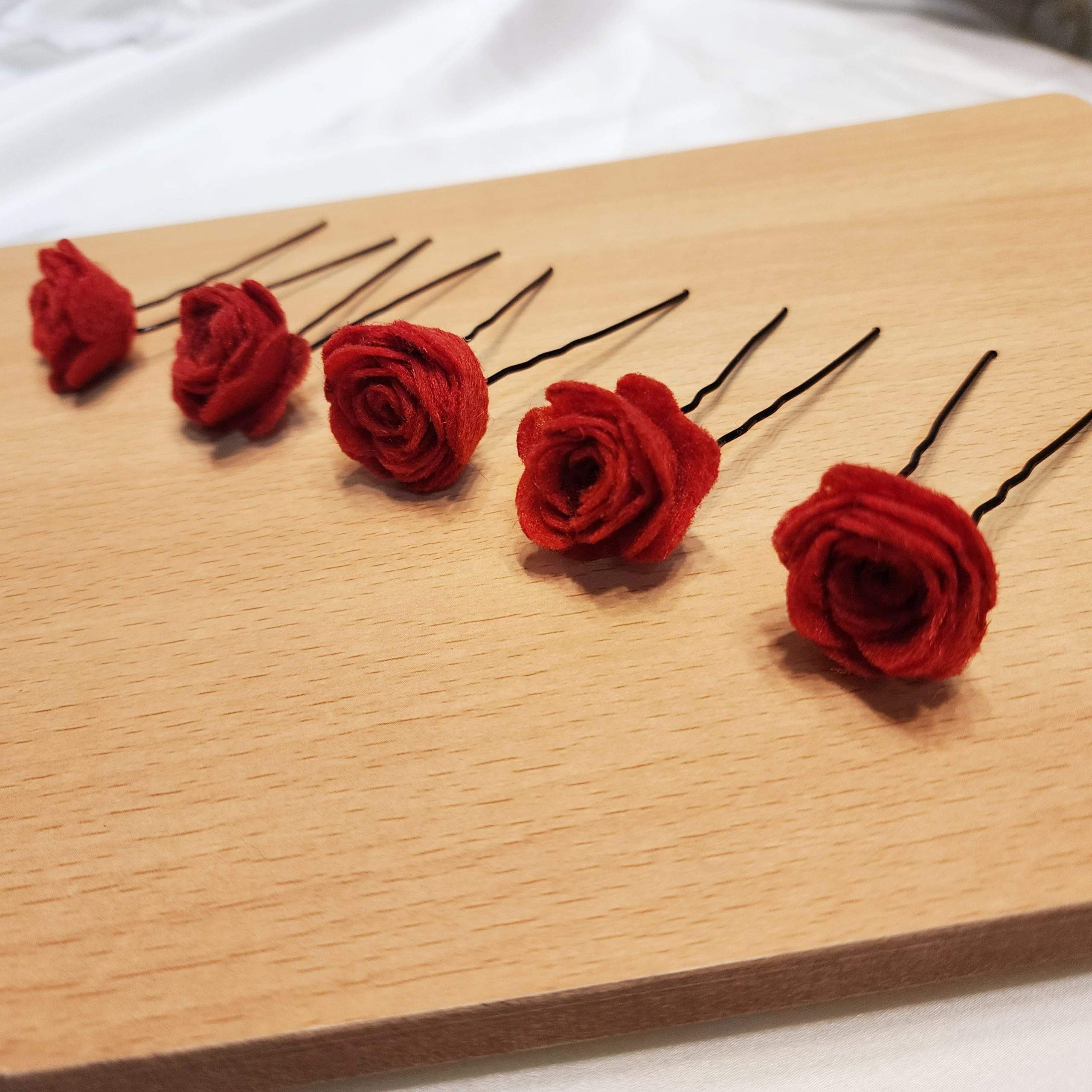 Red rose hair pins by Zarwish Javid