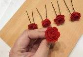 Red rose hair pins by Zarwish Javid
