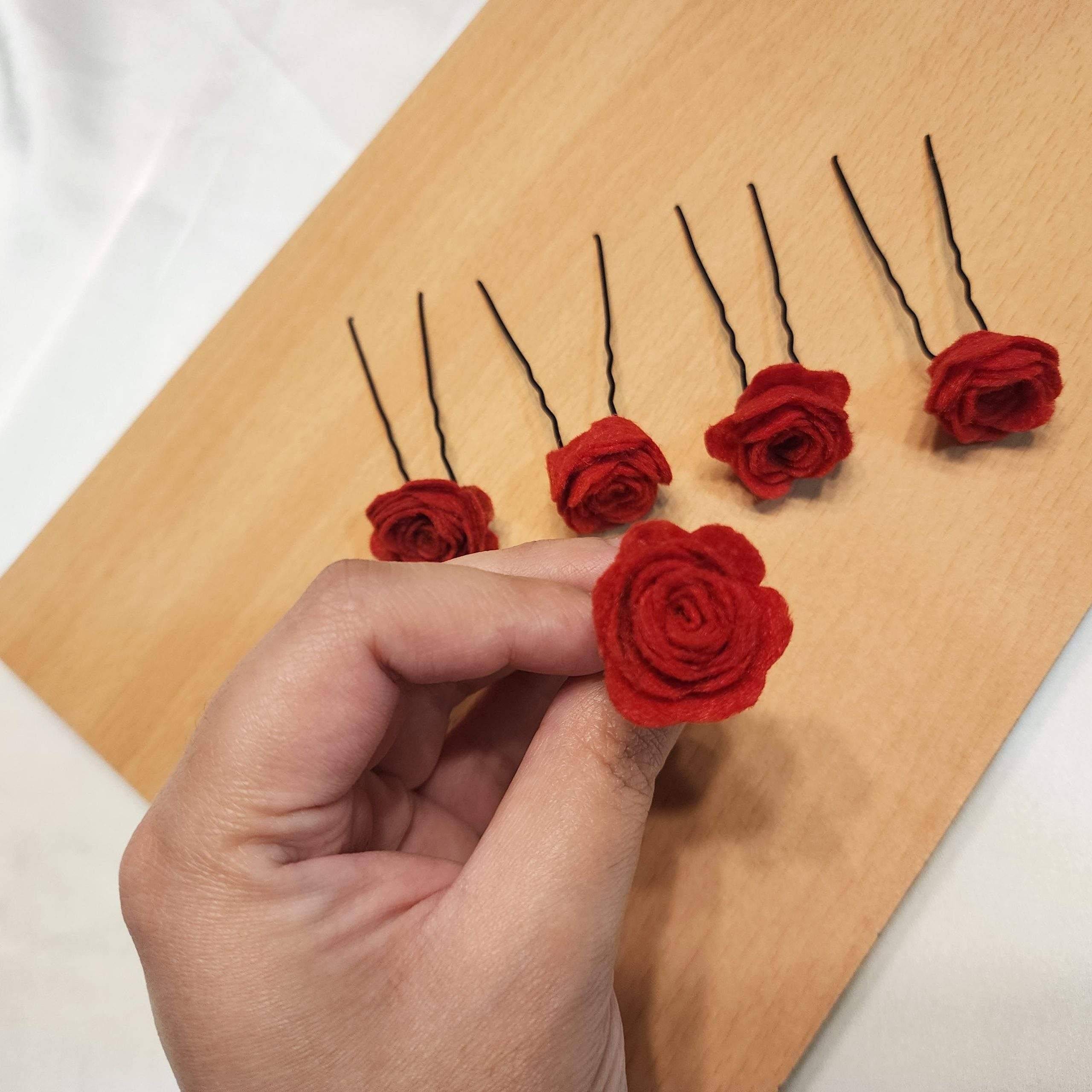 Red rose hair pins by Zarwish Javid