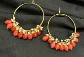 Orange hoop earrings by Zarwish Javid