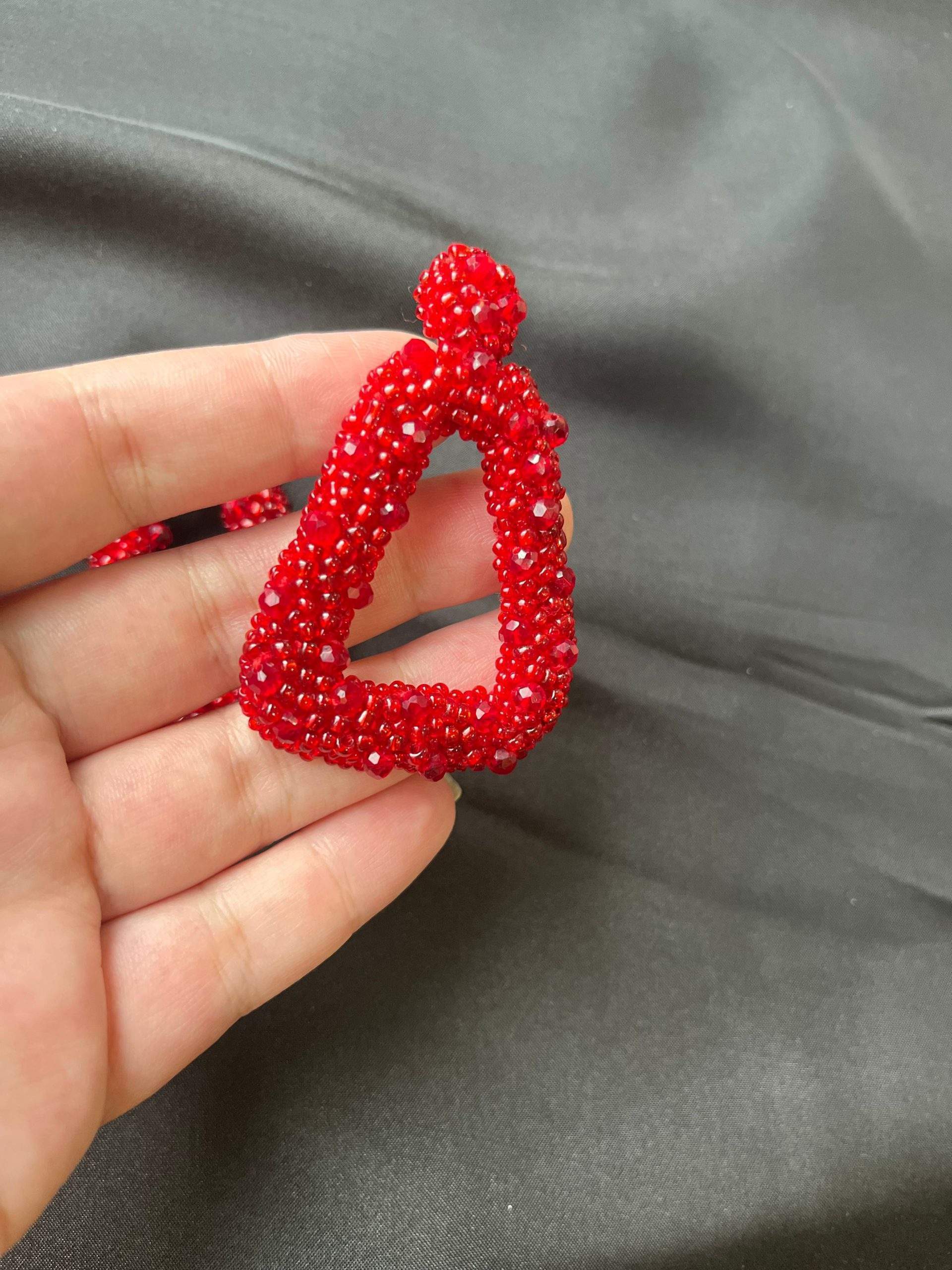 White and Red beaded earrings by Zarwish Javid