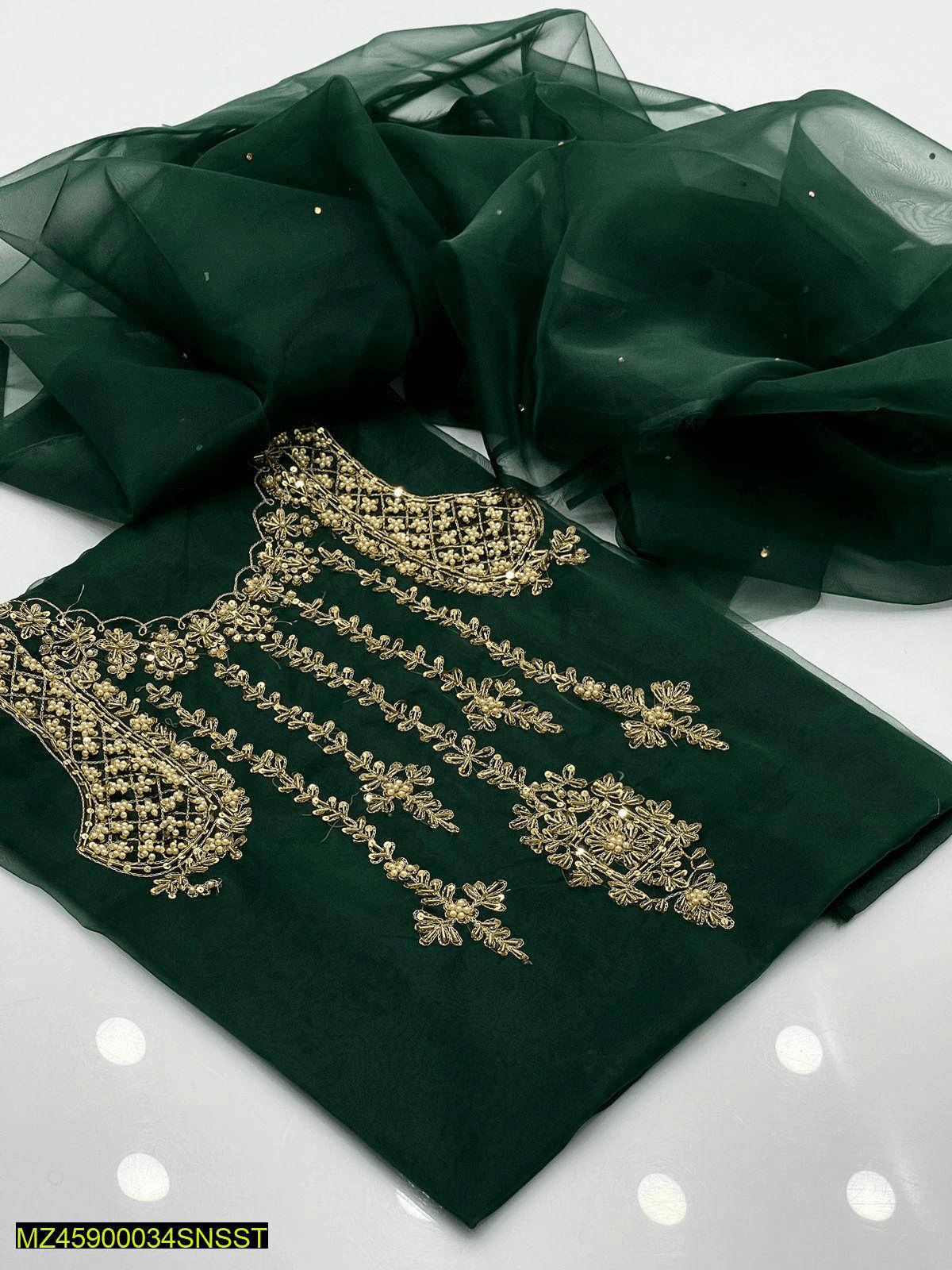 Woman’s unstiched clothes by Muhammad Naveed