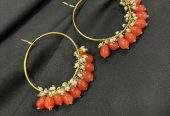 Orange hoop earrings by Zarwish Javid