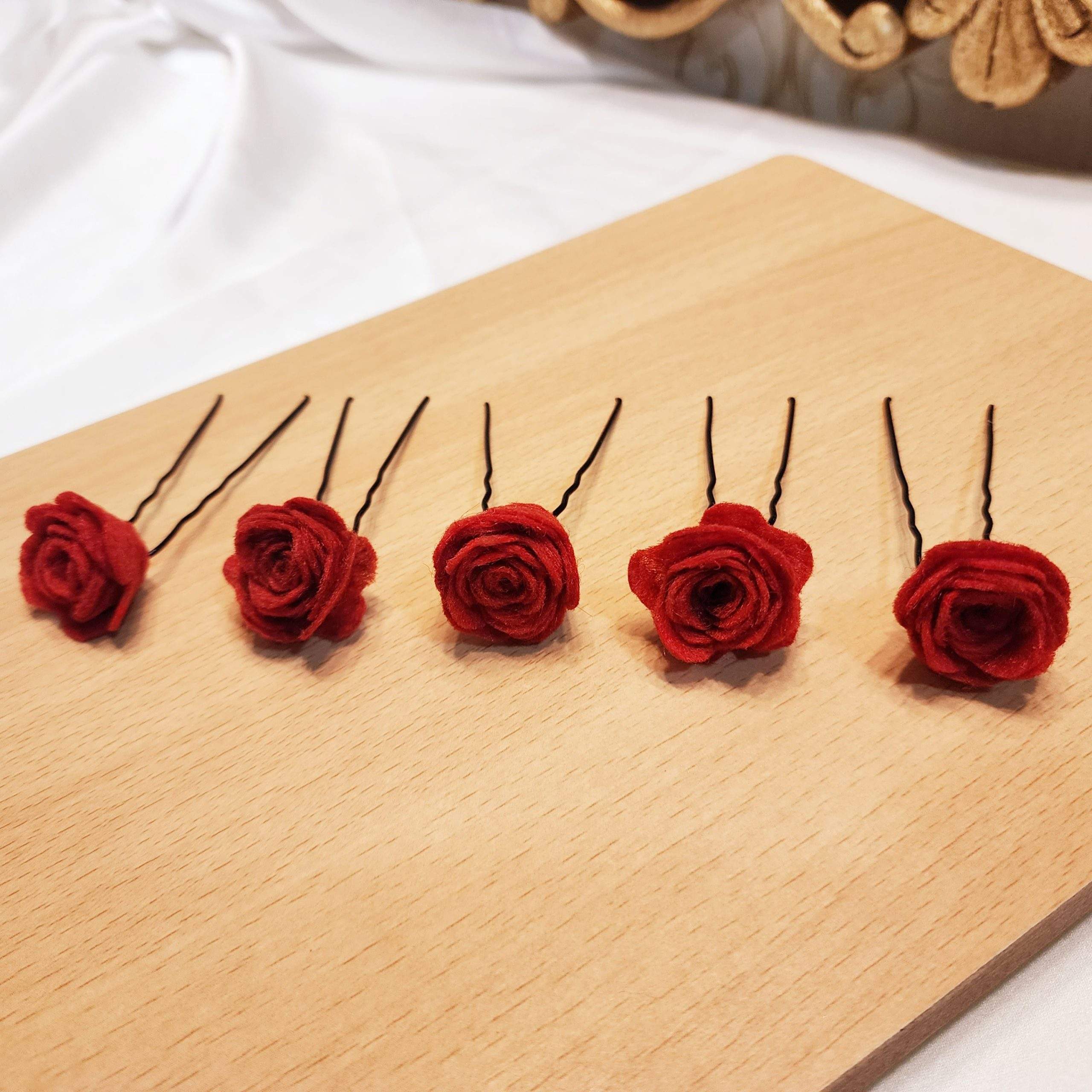 Red rose hair pins by Zarwish Javid
