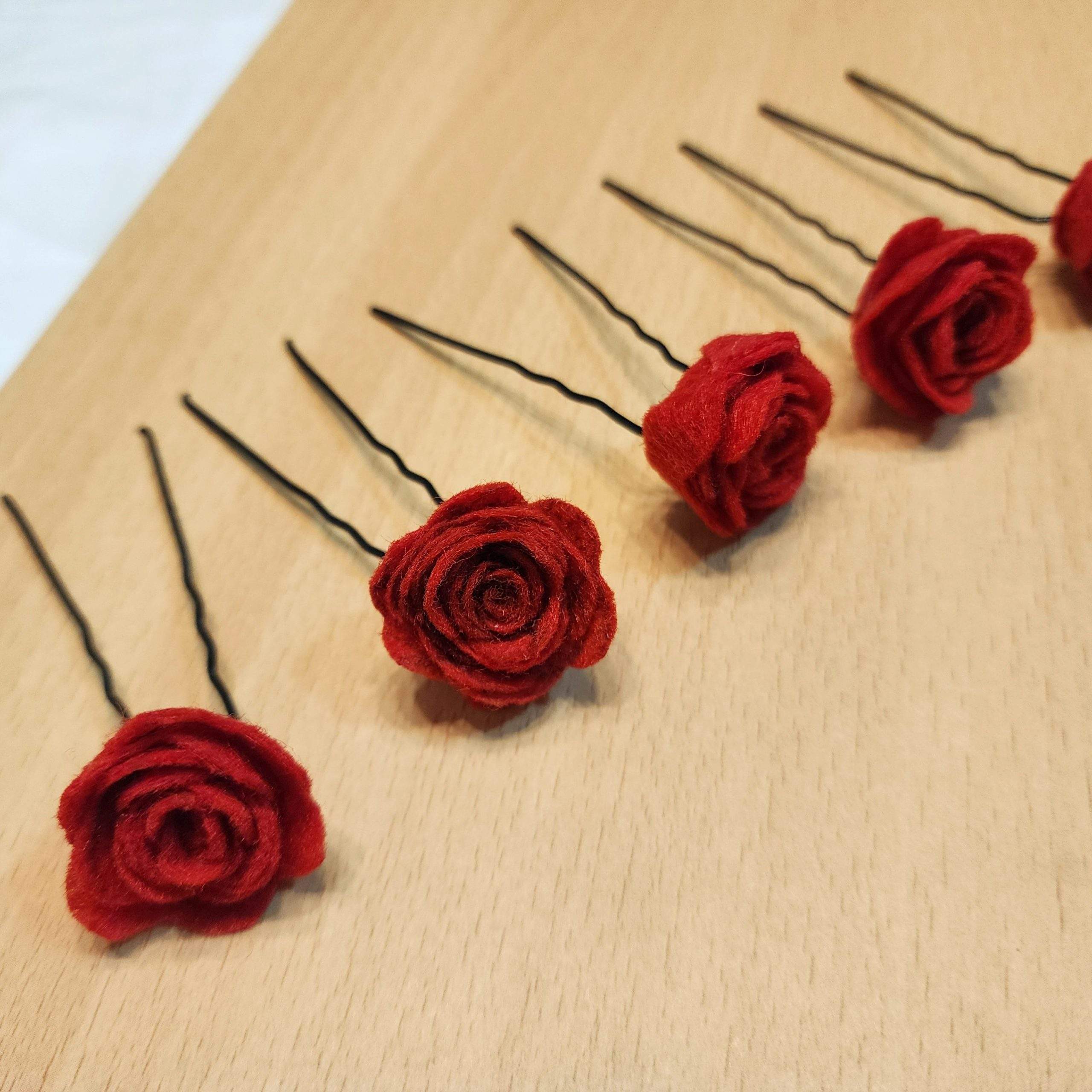 Red rose hair pins by Zarwish Javid