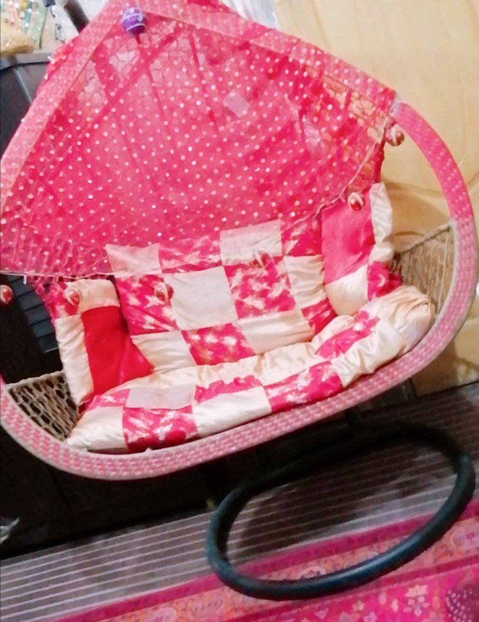 A double seat swing ( Jhoola) by Eisha Khan