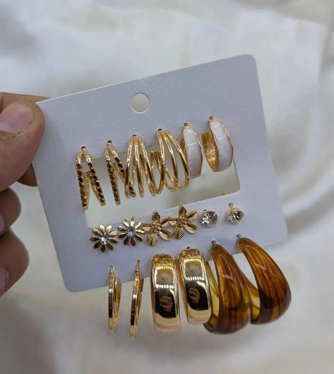 9 pair of earrings, FD