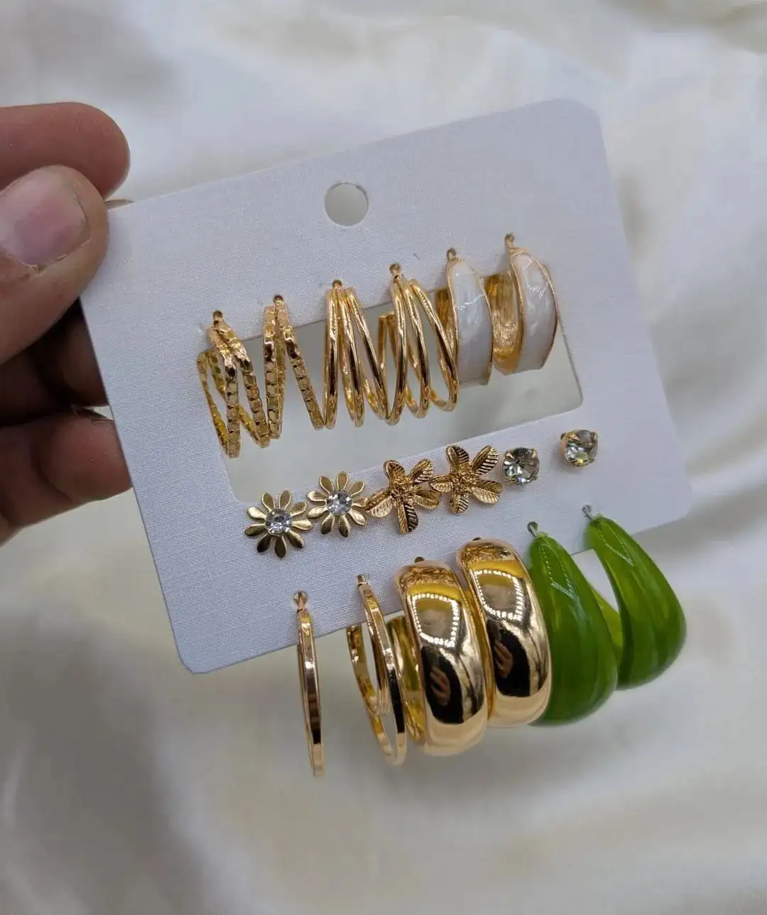 9 pair of earrings, FD