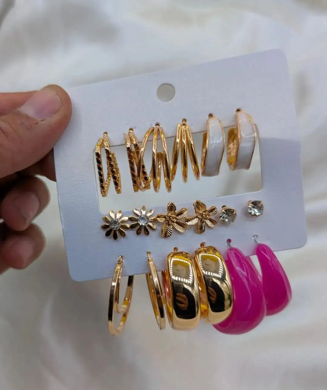 9 pair of earrings, FD