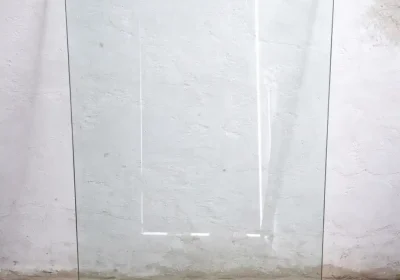 Clear-glass-tabletop-against-white-wall