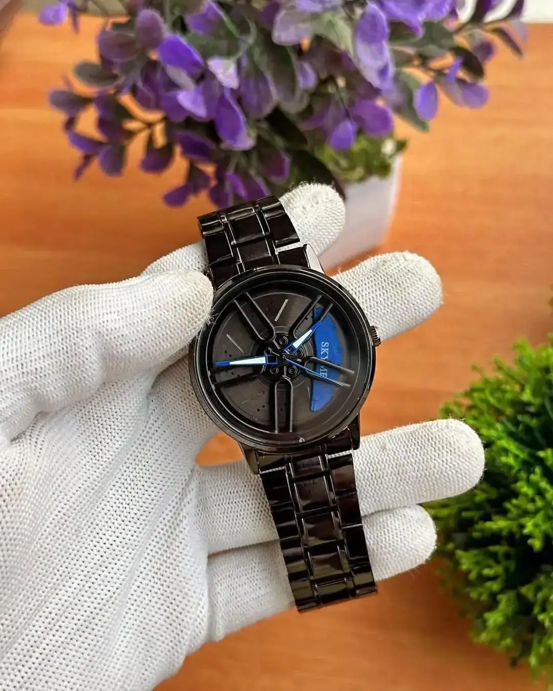 Spinning watch blue dial black strap multicolour