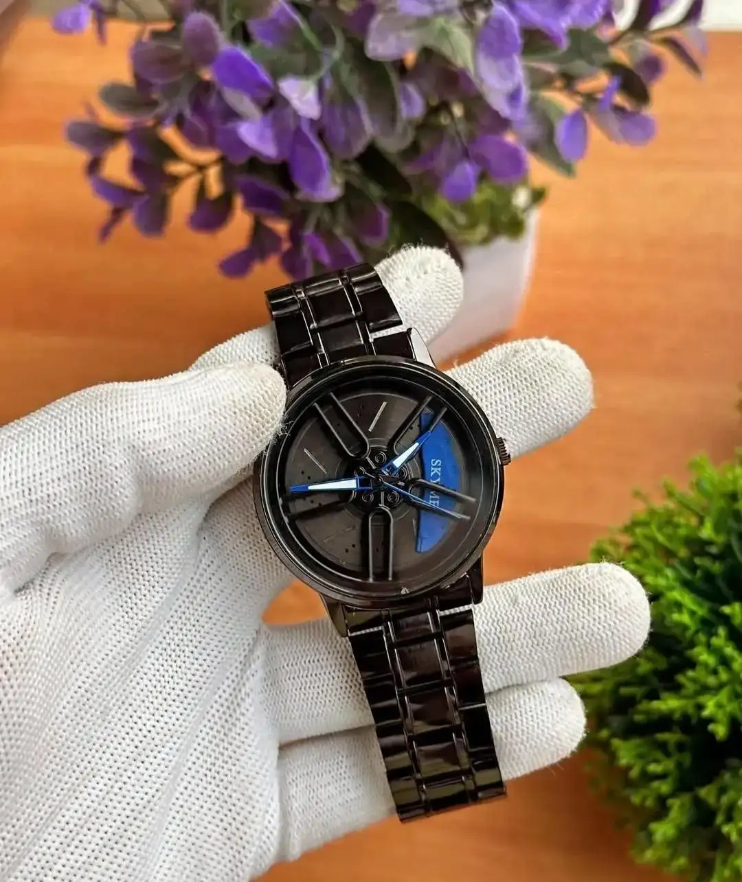 Spinning watch blue dial black strap multicolour
